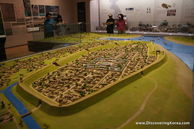Recreated model of the capital city at Baekje Museum Seoul. The model is of an island surrounded by river, green spaces and the city surrounded by walls.