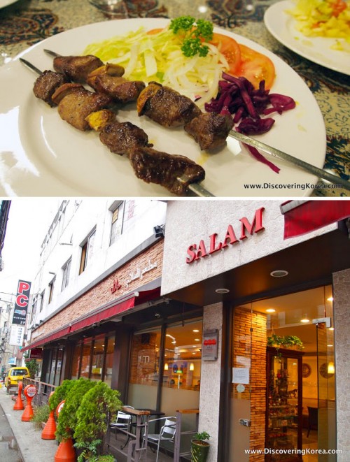 Two images, the top one showing meat on skewers with salad garnish, on a white plate on a floral table. The bottom image is of the outside of a restaurant, in red and white, with green ornamental trees and chairs outside.