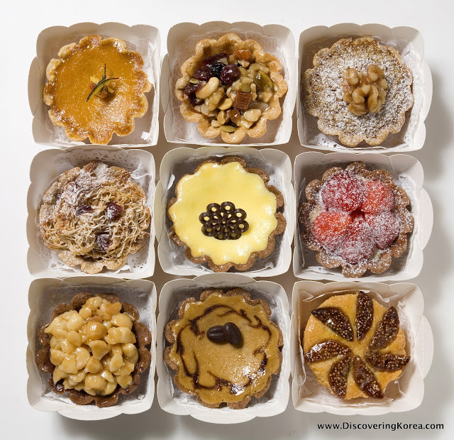 A selection of nine different pastries from La Bonne Tarte on a white background.