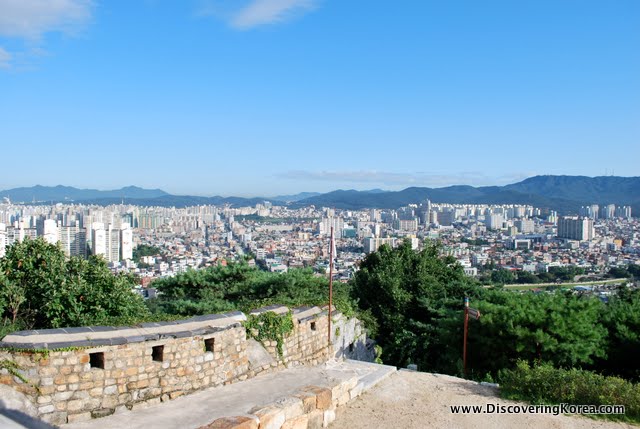 City view in bright sunshine from the wall of Suwon Hwaseong fortress.